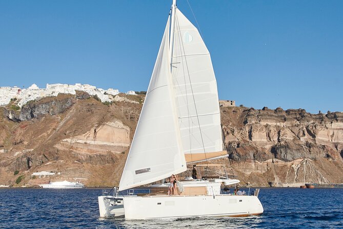 Santorini Gold Catamaran Cruise with BBQ, Drinks and Hotel Pickup - Volcano hot springs: the swim people talk about