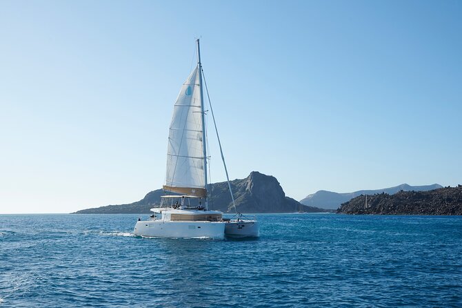 Santorini Gold Catamaran Cruise with BBQ, Drinks and Hotel Pickup - Mesa Pigadia Beach: a calmer swim plus your onboard meal