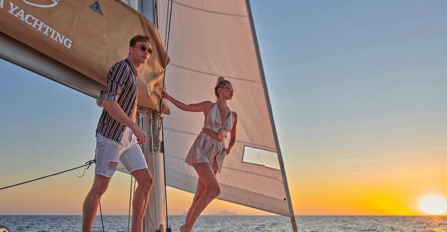 Santorini Gold Catamaran Cruise with Snorkel, BBQ & Open Bar - Stop 1: Red Beach Swim and Snorkel Off the Iconic Cliffs