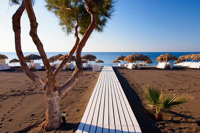 Santorini In One Day Bus Tour with Oia Sunset & optional Sailing - Red Beach quick stop and Perissa black sand break