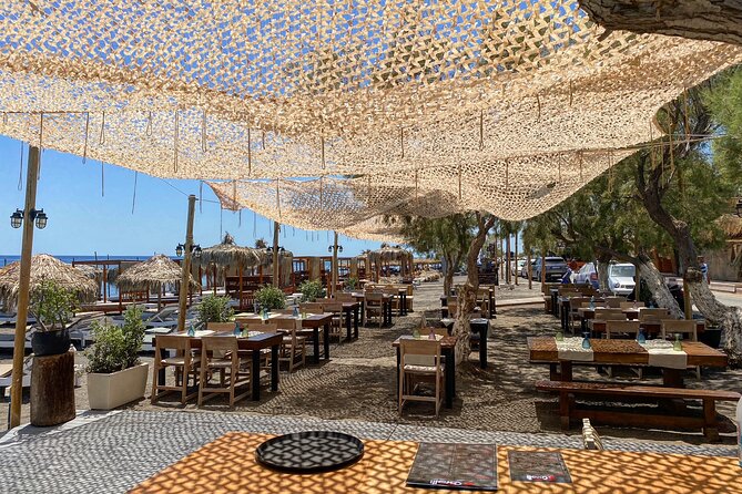 Santorini like a local: Discover local flavors by exploring the island! - Venetsanos Winery above Athinios port: views plus serious tasting