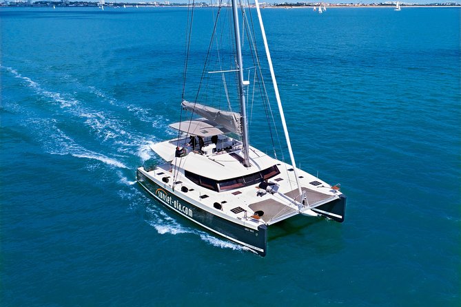 Santorini Luxury Catamaran Day Cruise with BBQ,drinks,transfer - Sailing past the Volcano and Palea Kameni: the views come fast