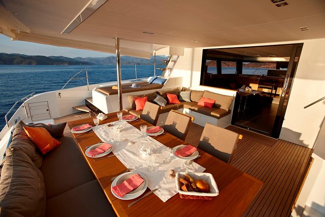 Santorini Luxury Catamaran Day Cruise with BBQ,drinks,transfer - Hot Springs swim: short time, real trade-offs