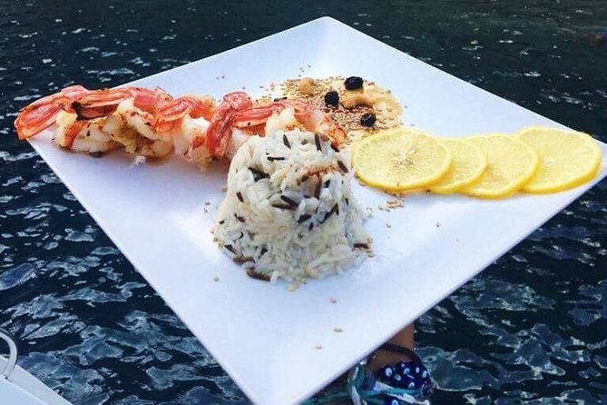 Santorini Luxury Catamaran Sunset Cruise with BBQ, Drink and Transfer - What you’re really buying for $157.28