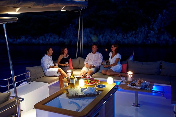 Santorini Luxury Catamaran Sunset Cruise with BBQ, Drink and Transfer - The sail: Volcano area, Palea Kameni, and that sea-level lighthouse view
