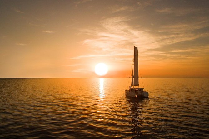 Santorini Luxury Catamaran Sunset Cruise with BBQ, Drink and Transfer - Hot Springs stop: warm water near the volcano (but not on the beach)