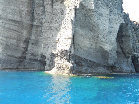 Santorini Luxury Catamaran Sunset Cruise with BBQ, Drink and Transfer - Red Beach snorkel: short swim window, great color contrast