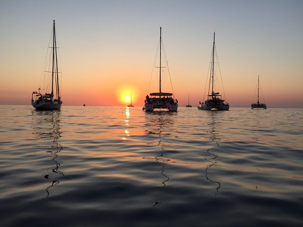 Santorini Luxury Catamaran Sunset Cruise with BBQ, Drink and Transfer - White Beach BBQ stop: longest swim plus lunch onboard