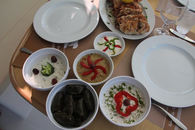 Santorini Luxury Sailing Catamaran Cruise with BBQ, Drinks and Transfer - Hotel pickup and a calm start from Amoudi Port