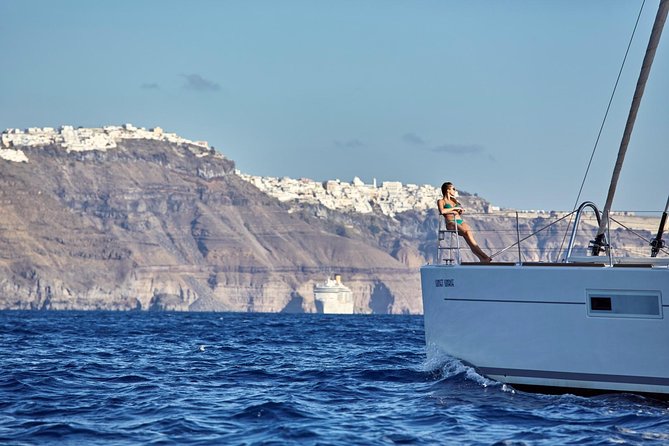 Santorini Luxury Sailing Catamaran Cruise with BBQ, Drinks and Transfer - White Beach swim time plus a full Greek BBQ on board