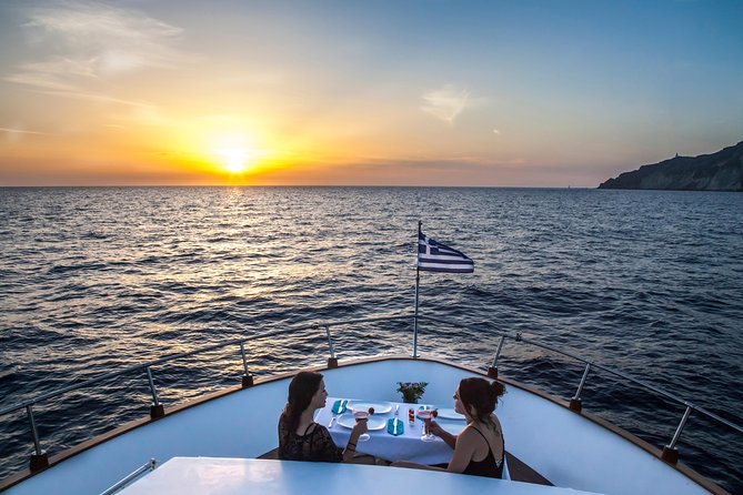 Santorini: Motor Yacht Sunset Cruise with 5-Course Dinner - Sailing the caldera: from red and white beaches to Palea Kameni and Nea Kameni