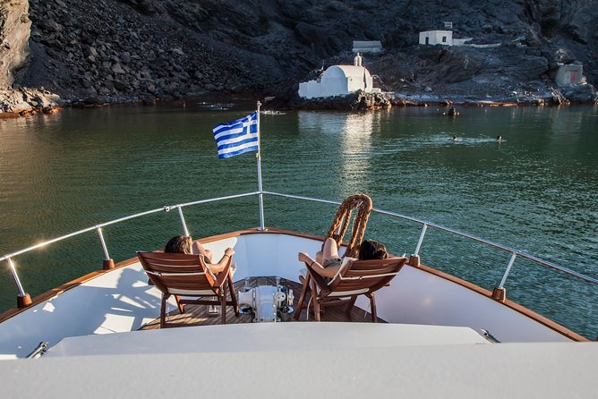 Santorini: Motor Yacht Sunset Cruise with 5-Course Dinner - Santorini Volcano stop: 30 minutes, admission included, and what not to expect
