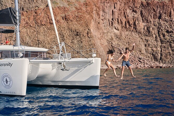 Santorini Oia: Private Sunset Catamaran Cruise with BBQ & Drinks - The sea views in between: lighthouse moments and old-port photos