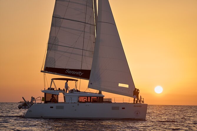 Santorini Oia: Private Sunset Catamaran Cruise with BBQ & Drinks - Stop 4, Mesa Pigadia Beach: secluded black-sand water
