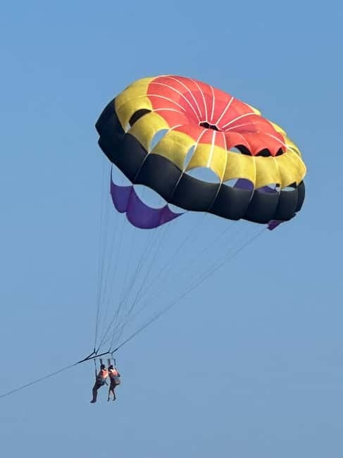 Santorini: Parasailing ExperiencePerissa,Perivolos,St.George - 350 Feet Up: What You Really See Over Santorini’s Black Beach