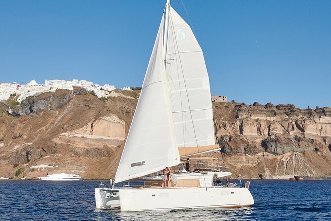 Santorini Platinum Catamaran Cruise with Meal, BBQ and Open Bar - The First Look at Santorini: Red Beach and Its Photo Moment