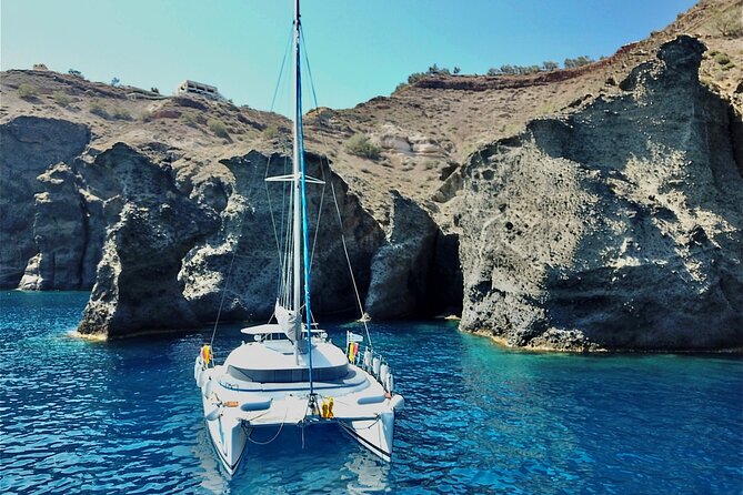Santorini: Premium Small-Group Catamaran Cruise with Food/Drinks - The sailing rhythm: Akrotiri briefing, net rules, and how to stay safe