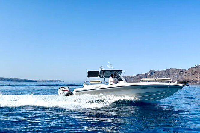 Santorini private boat tour - Stop 1: Santorini Volcano stop, for drama and photo angles