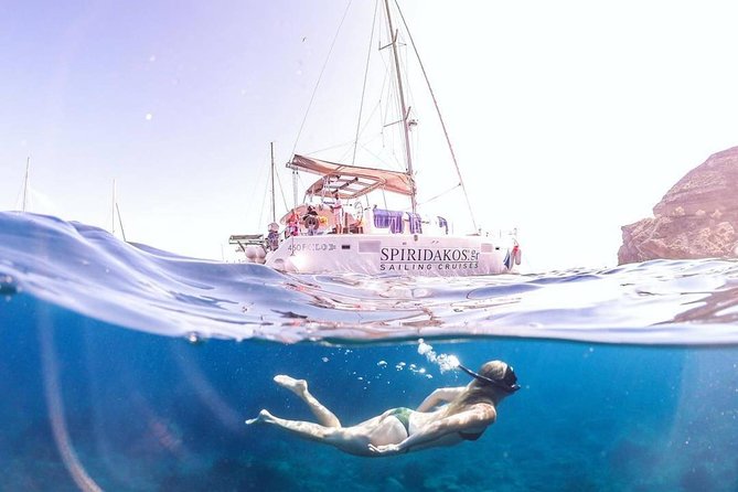 Santorini Private Catamaran Cruise with BBQ, Open Bar & Transfers - Mesa Pigadia, a calmer bay where you swim from the boat