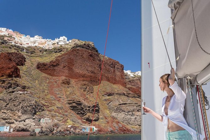 Santorini Private Catamaran Cruise with BBQ, Open Bar & Transfers - Palea Kameni hot springs, where you trade salt water for warm sulfur heat