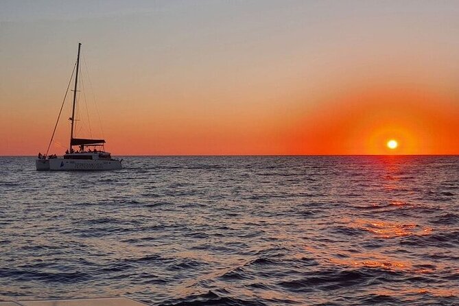 Santorini Private Catamaran Cruise with BBQ, Open Bar & Transfers - BBQ lunch on the volcanic island, open bar included