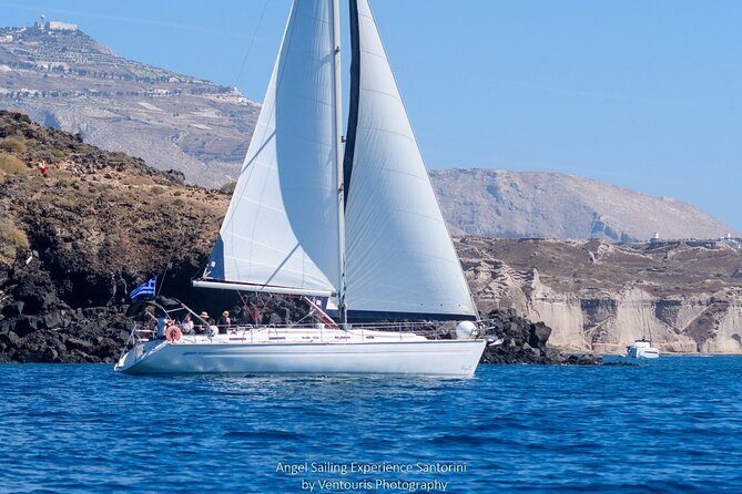 Santorini Private Daytime Sailing Tour with Meal, Drinks &Transfer included - Between the volcanoes: lighthouse, hot springs, and Caldera drama