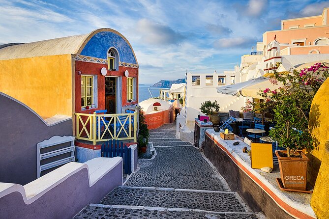 Santorini Private Half-Day Sightseeing Tour - Oia main street: blue-domed icons, red volcanic rock, and real photo time