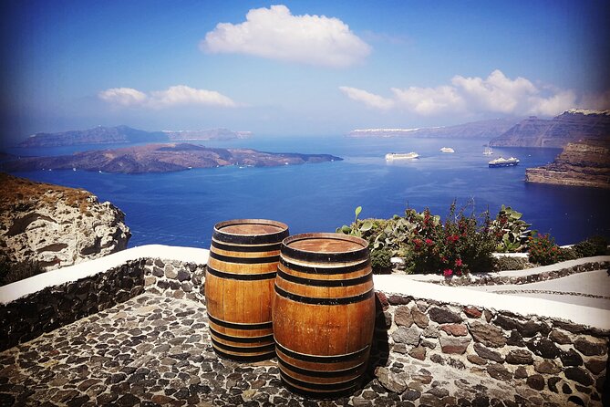 Santorini Private Romantic Tour with Dinner & Wine Tasting - Oia first stop: white lanes, blue domes, and the romance setup