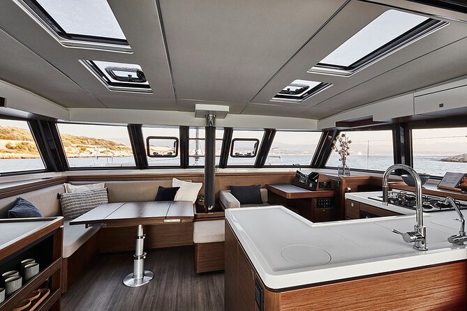 Santorini Private Tour Half-Day Sailing Platinum Catamaran Cruise - Mesa Pigadia near Akrotiri: black pebbles and clear water time