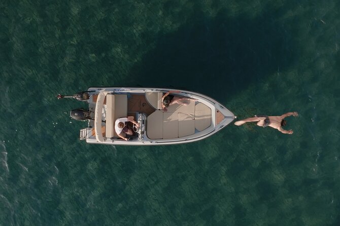 Santorini Rent a Boat - License free private cruise - The boat setup: shade, snacks, and comfort that actually helps