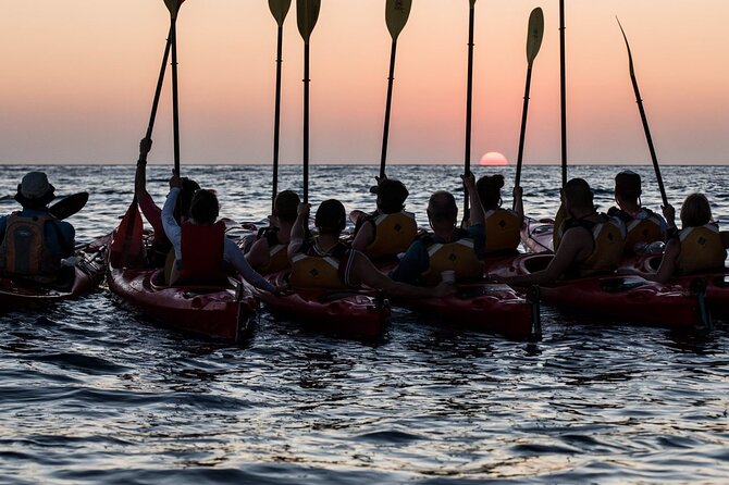 Santorini: Sunset Sea Kayak with Light Dinner with Pick-up Option - Dinner in a Santorini tavern: why the meal feels like part of the sunset