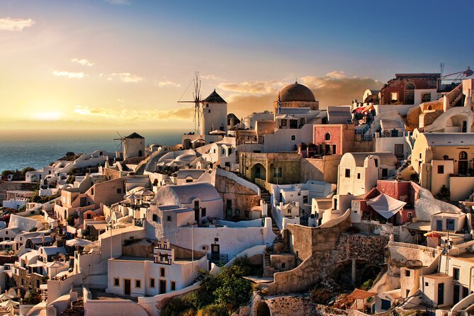 Santorini Sunset Walking Tour inc. tastings and 5 drinks - Fira at dusk: souvlaki, wine, seasonal dishes, and spirit culture