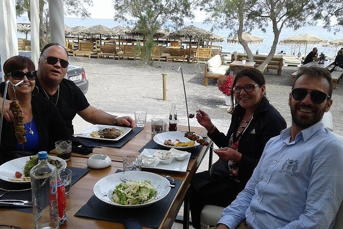 Santorini Ultimate Destinations - Perissa black sand beach: the best hour for sun, swim, and lunch choices