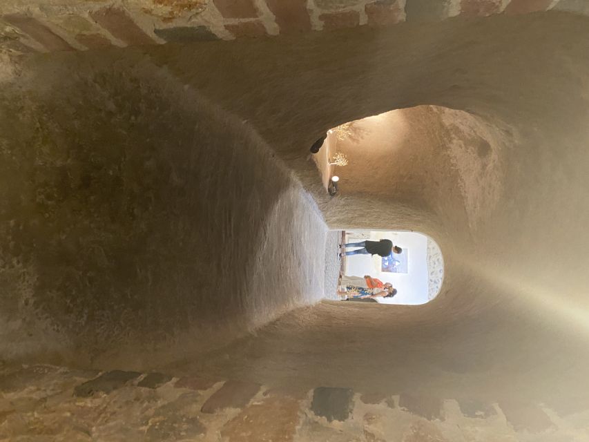 Santorini: Wine Tasting and Cave Settlement Tour - The Cave Settlement: Lava Homes, Cobblestones, and Blue Dome Photos