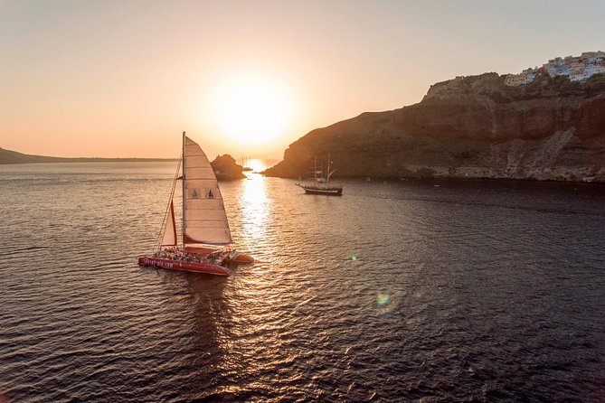 Sunset Sailing Catamaran Cruise in Santorini with BBQ and Drinks - Hotel pickup, ports, and the small rules that save your time