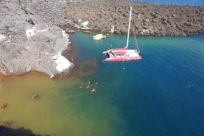 Sunset Sailing Catamaran Cruise in Santorini with BBQ and Drinks - Drinks, BBQ, and the music reality onboard