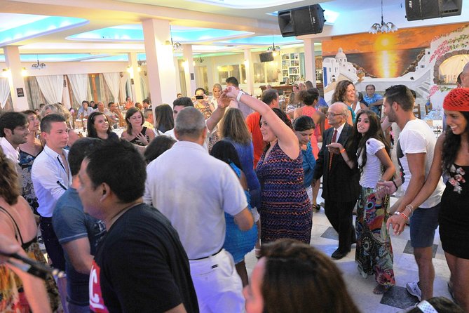 Traditional Greek Night live Music & Dinner Show in Santorini - Crowd reality and how to enjoy the experience anyway