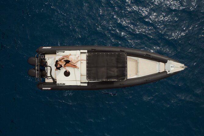 Unique Half-Day Private Motor Boat Cruise in Santorini - Getting on board: pickup, meeting point, and small-group comfort